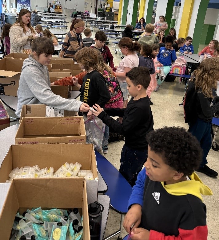 Early Act students pack hygiene kits