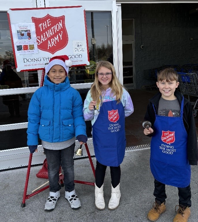 Early Act students ring the bell for Salvation Army